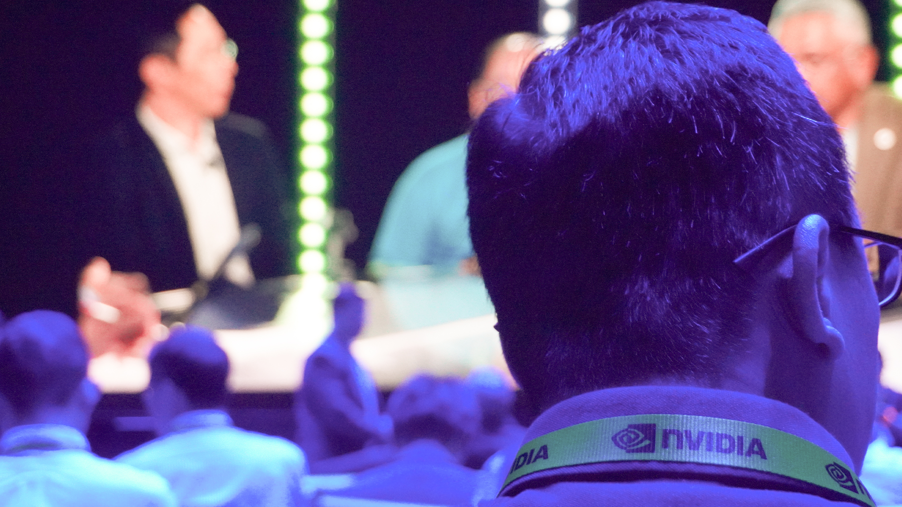 Nvidia Computex 2025 showfloor with person facing away wearing Nvidia lanyard