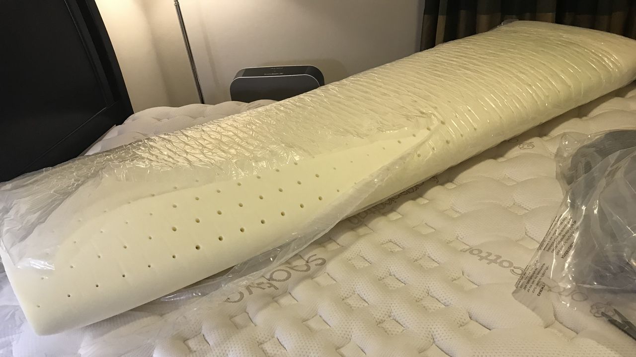 The Casper Comfy Mattress Topper being unboxed.