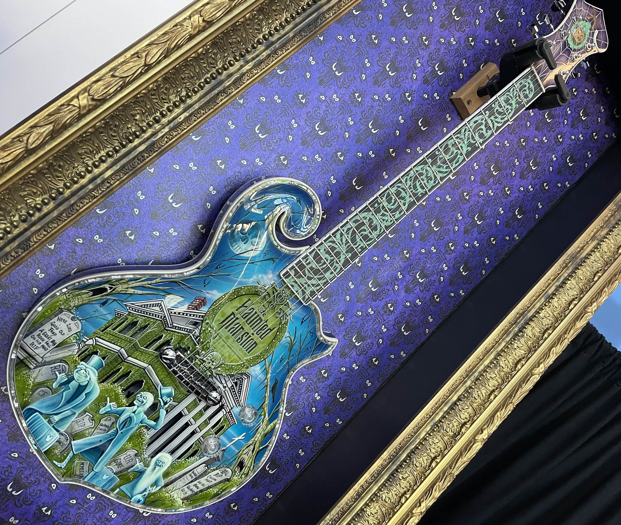 Custom guitars might not be everyone’s thing and often out of the reach of most budgets, but there’s no denying that this Haunted Mansion paint job on Minarik Guitars’ Scroll model is very well done indeed.