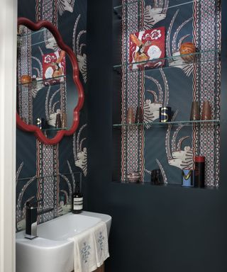 Blue bathroom, white and red mouse wallpaper, red mirror frame
