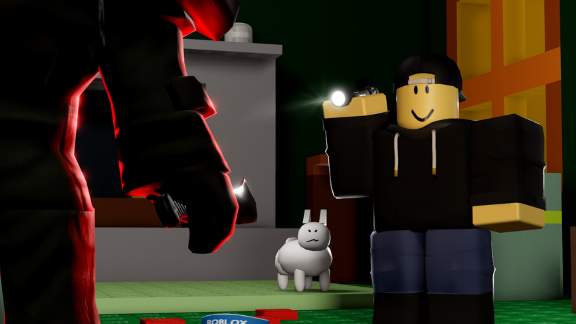 A character in a black hoodie holds up a flashlight to a silhouetted killer with a knife.