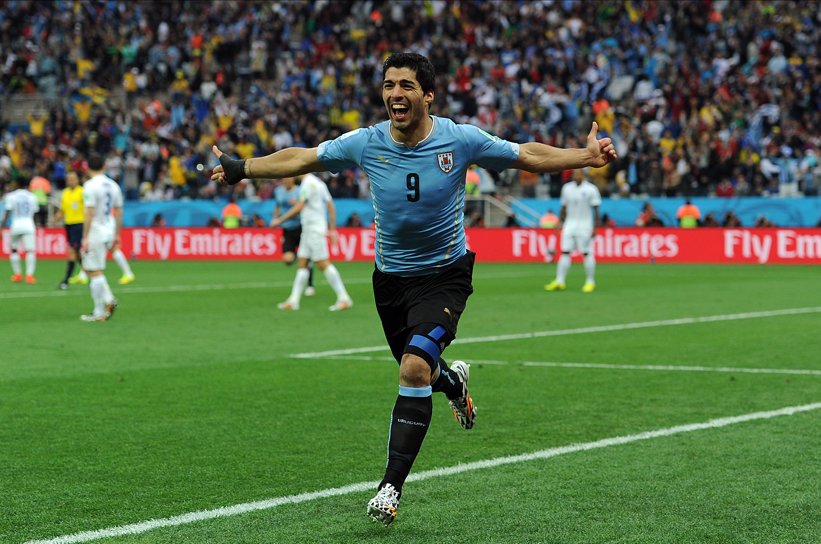 Luis Suarez celebrates after scoring for Uruguay against England at the 2014 World Cup.