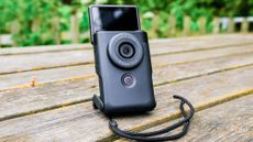 A black Canon PowerShot V10 vlogging camera