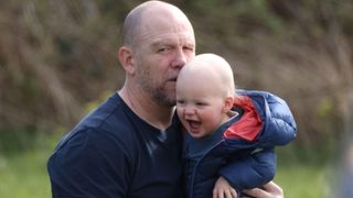 Mike Tindall with son Lucas as they watch Zara Tindall competing in the Barefoot Retreats Burnham Market International Horse Trials