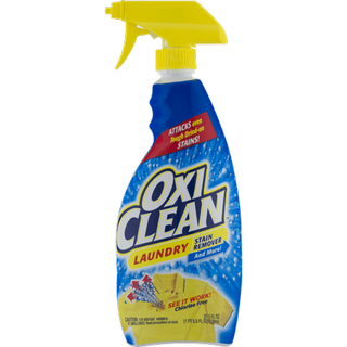 A blue plastic bottle of oxi-clean stain remover, yellow spray bottle lid