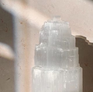 A selenite crystal tower with light rays