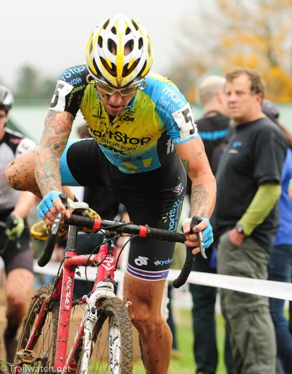 Adam Myerson (Smartstop-Mountain Khakis) remounting after the barriers.