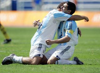 Javier Mascherano and Roberto Ayala embrace after Argentina beat Paraguay to win the gold medal in the men's football tournament at the 2004 Olympics in Athens.