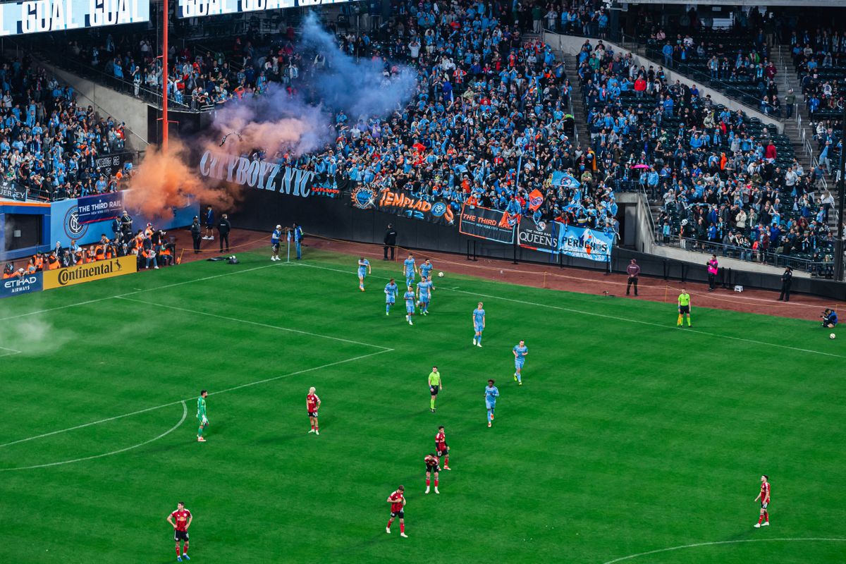 An aerial shot of the players returning to their positions after the first goal