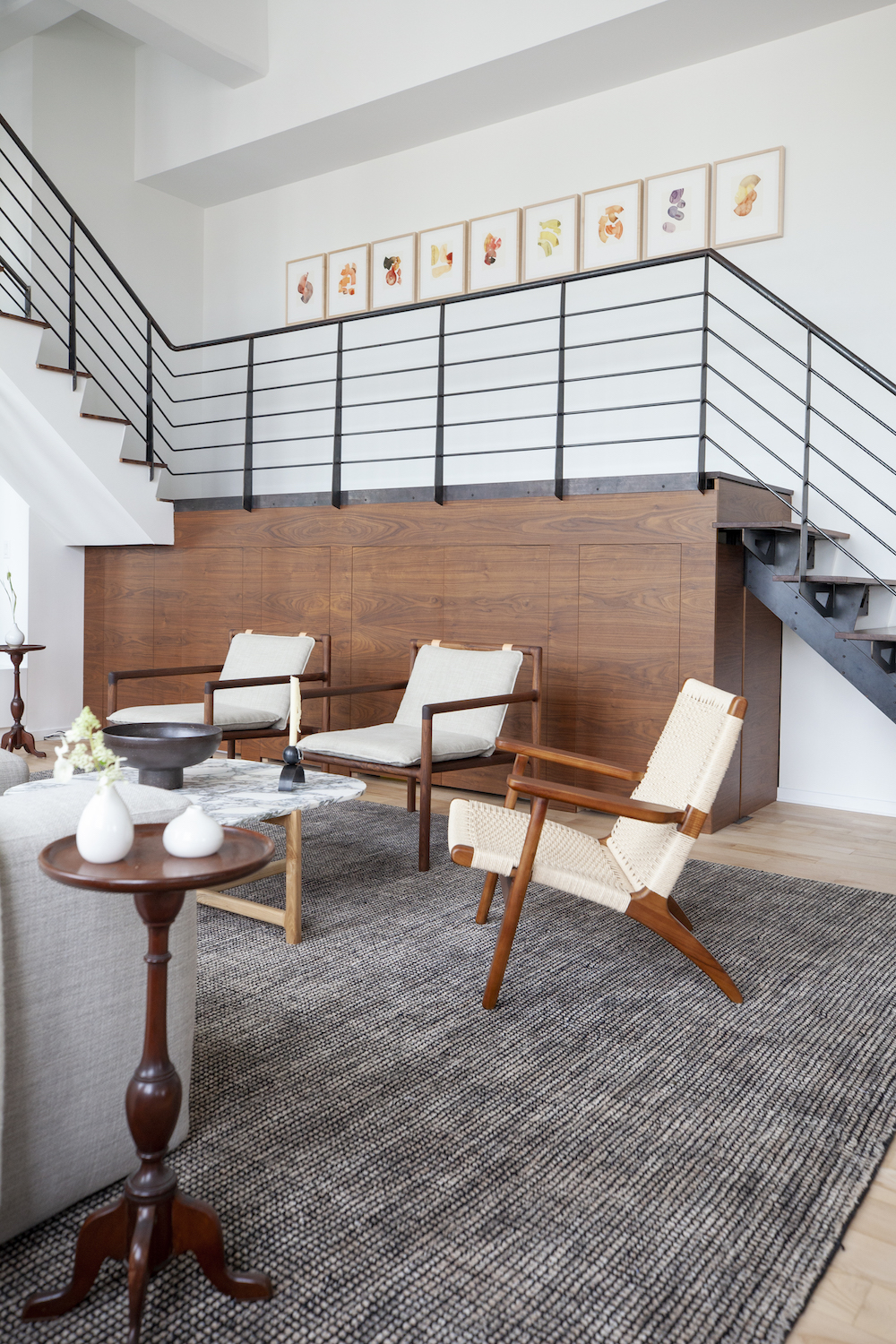 Living room with iron staircase and under stair storage