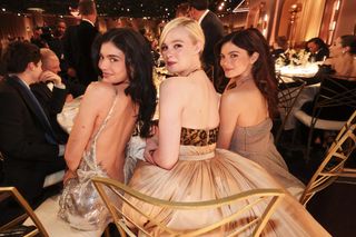 Kylie Jenner sits with Elle Fanning and Michele Barbaro from A Complete Unknown at the 2025 Golden Globes