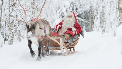 Santa riding in a sleigh in Finland