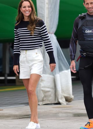 Kate Middleton wearing a striped top and shorts.