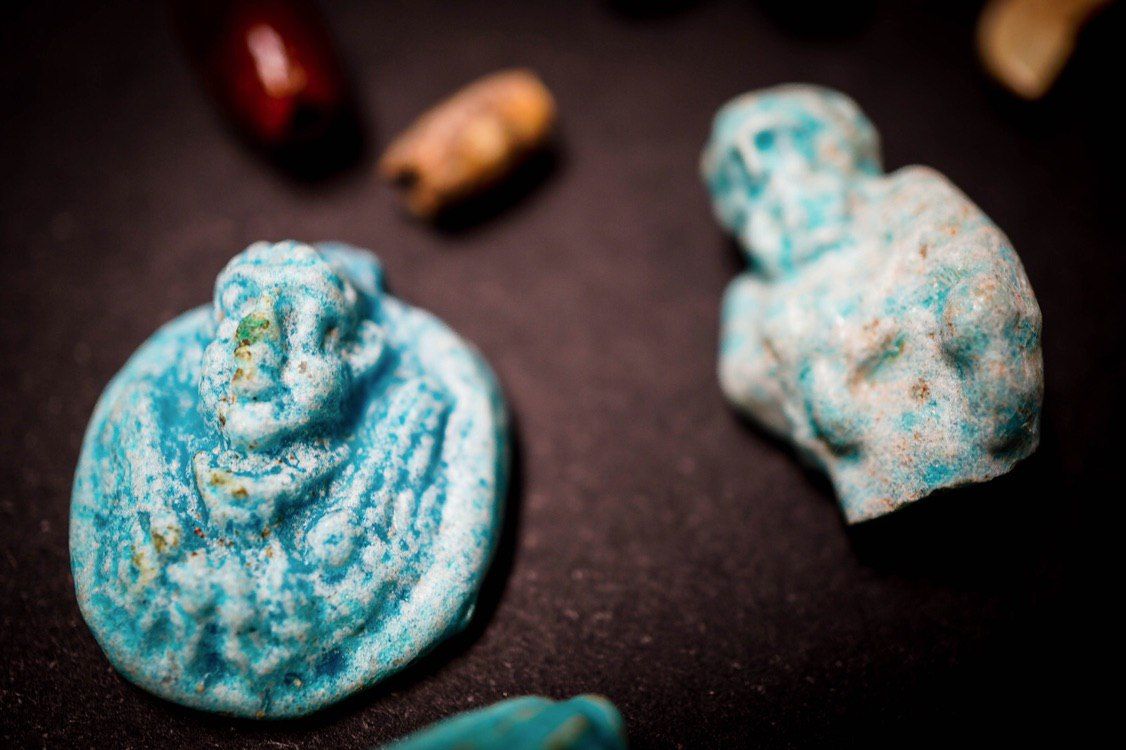 These amulets were likely used for decoration or protection.