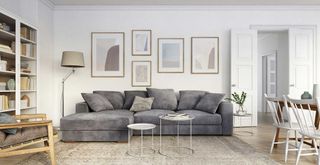neutral living room with grey sofa with doors painted in off white