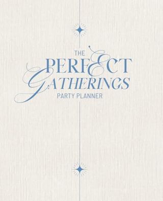 The white cover of a party planning journal with blue elegant writing