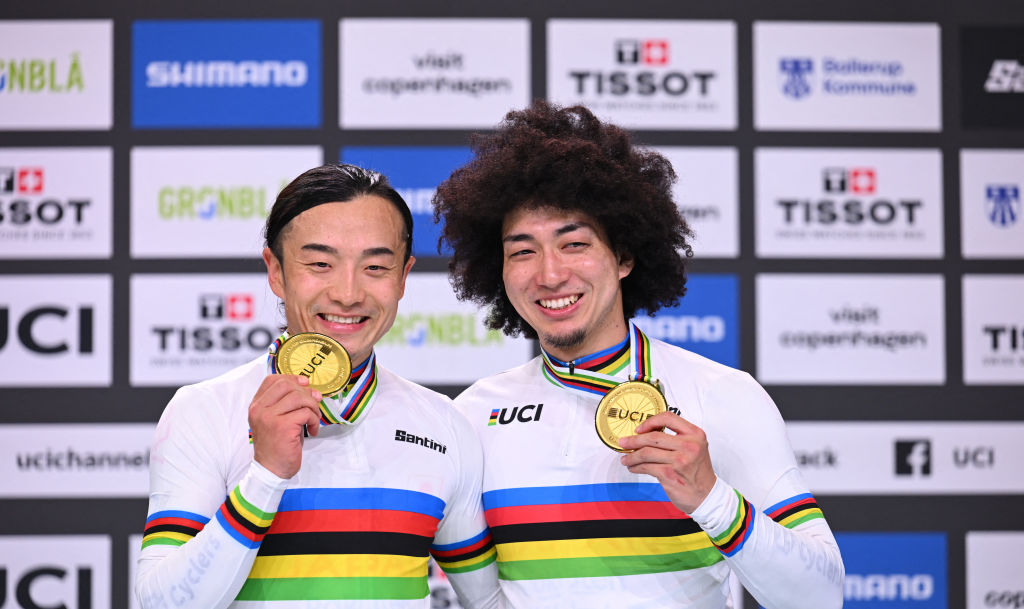 Winner of the Men's Scratch Race Japan's Kazushige Kuboki (L) and winner of the Men's Keirin Final Race Japan's Kento Yamasaki celebrate after the podium ceremeony of the UCI Track Cycling World Championships in Ballerup, Denmark, on October 17, 2024. (Photo by Jonathan NACKSTRAND / AFP)