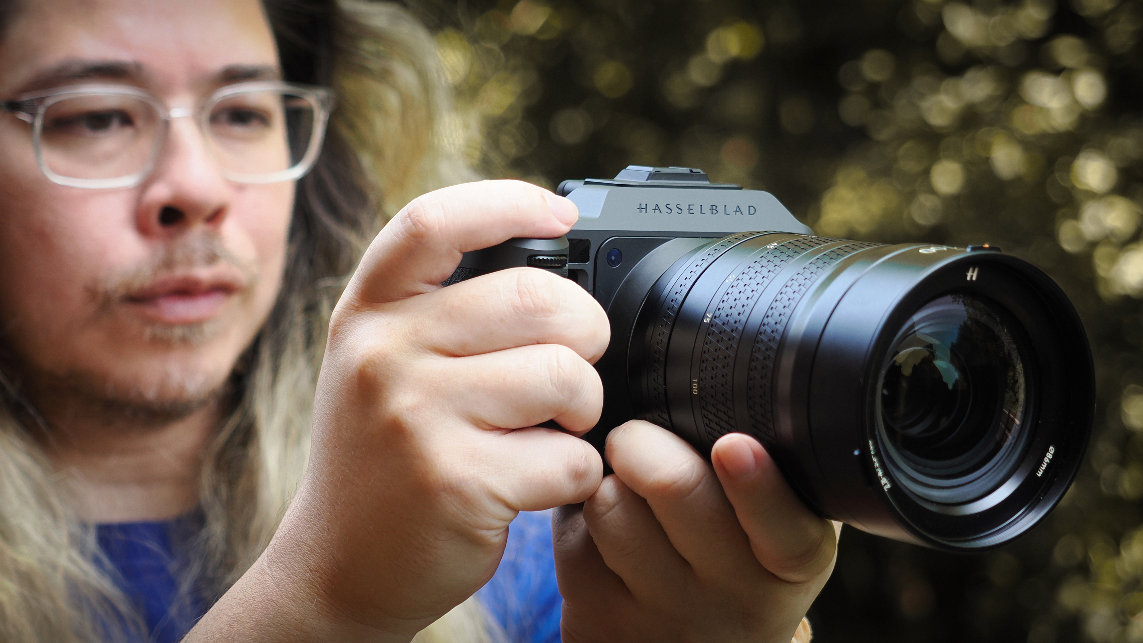 James Artaius holding a Hasselblad X2D II 100C with XCD 35-100E lens