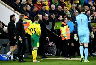 Referee Paul Tierney consults the pitchside monitor before changing Norwich’s Ben Godfrey’s card from a yellow to a red during the Premier League match against Bournemouth