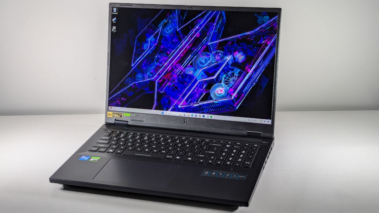 Angled view of the Acer Predator Helios Neo 18 open in front of a gray background.