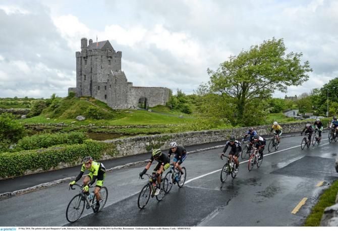 The peloton ride past Dunguaire Castle, Kinvara, Co. Galway