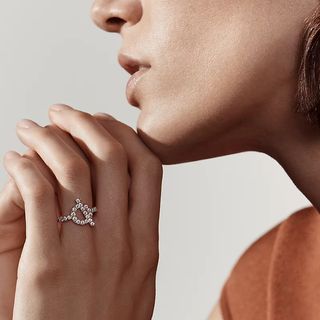 woman wearing hermes ring