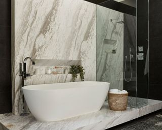 Large modern bathroom with raised marble level with white bath, shower unit with glass, woven storage basket, integrated alcove shelf with toiletries
