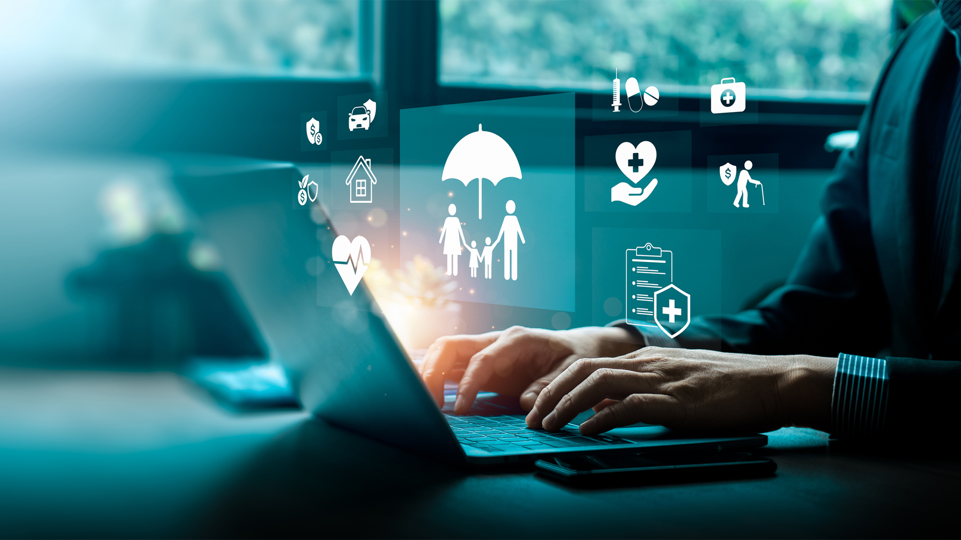 A person types on a laptop, with visualizations related to safety floating over their hands, such as a family under an umbrella