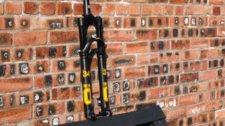 Ohlins RXF34 m.2 leaning against a wall