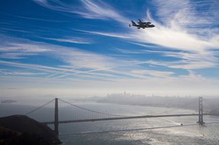 The space shuttle Endeavour flies over the Golden Gate Bridge in San Francisco, CA, Friday, Sept. 21, 2012.