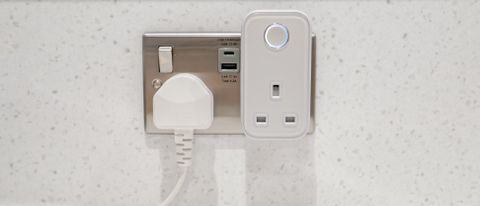 The front view of the Hive Active Smart Plug connected to an electrical outlet