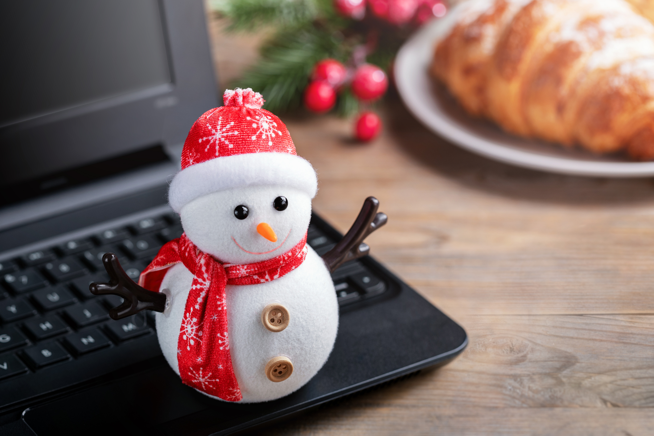 holiday snowman on a black computer keyboard