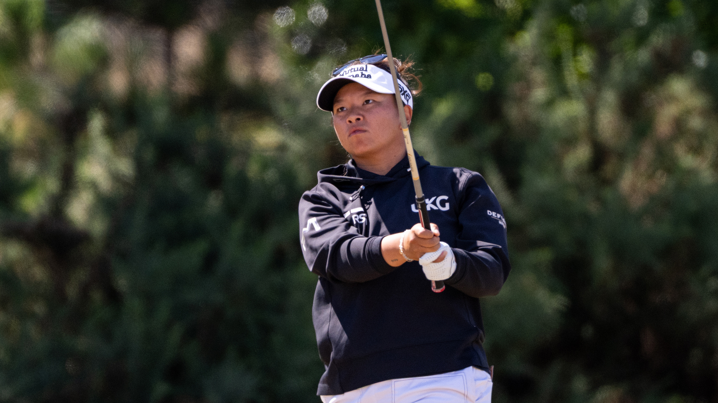 Megan Khang holds her finish on an iron shot