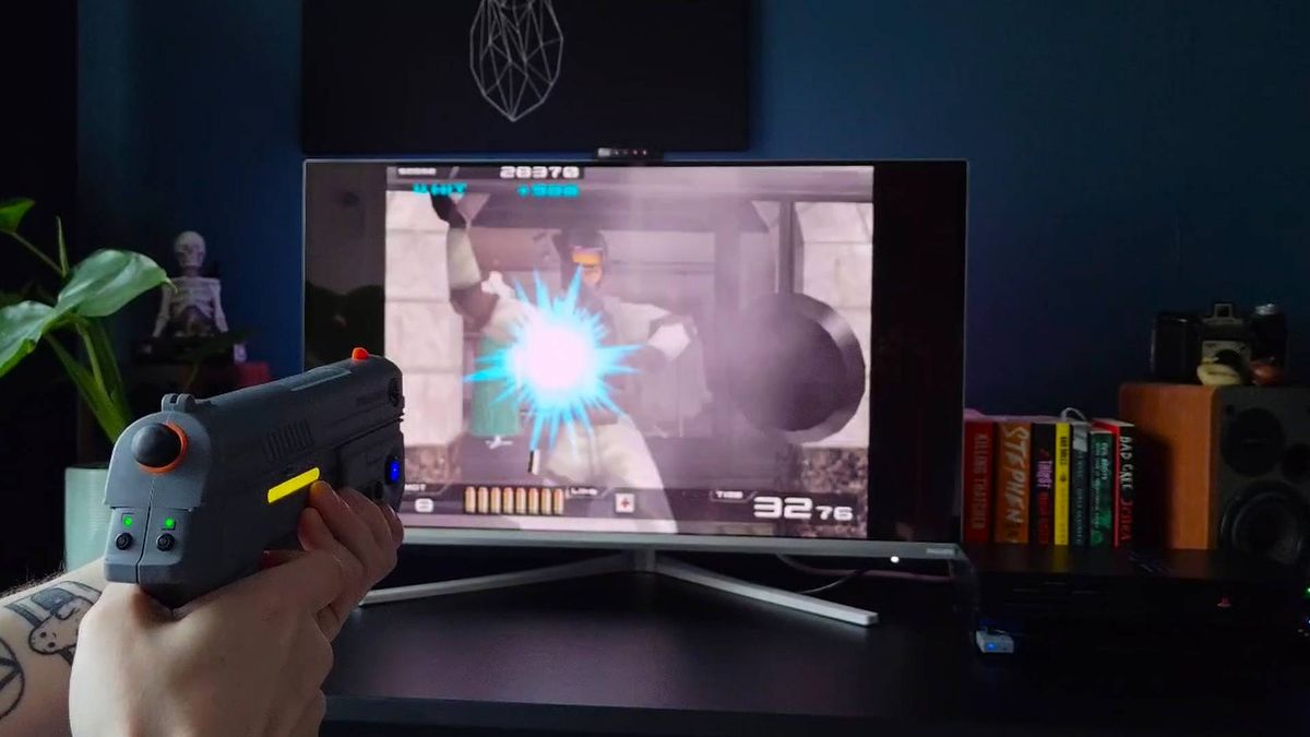 Hands using Intec Time Breaker Lightgun to shoot close up enemy in Time Crisis 2.