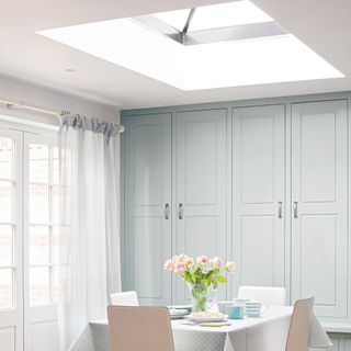 Roof lantern over dining room table, with patio doors to the side, flooding the room with daylight