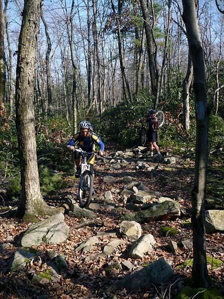 Rob Lichtenwalner shows how to ride the rocks on the John Wert trail.