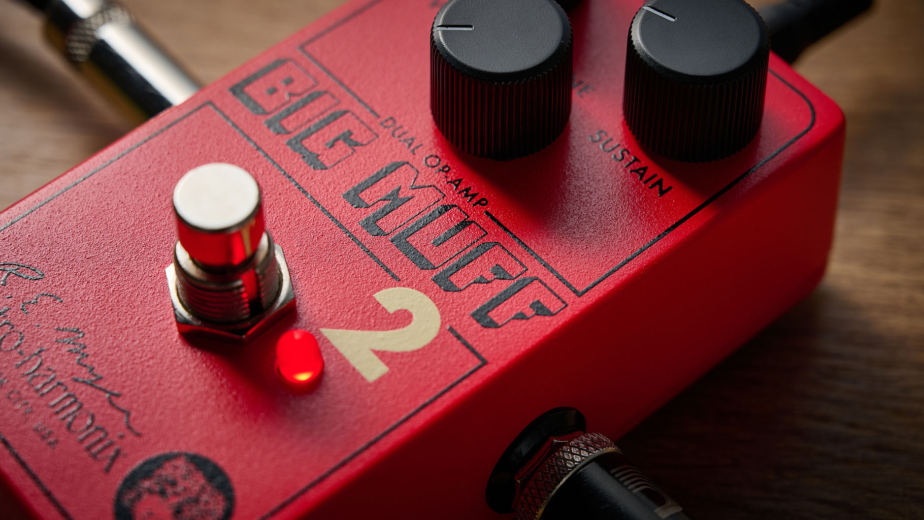 Electro-Harmonix Big Muff Pi 2 Dual Op-Amp Fuzz is built from a lost schematic that's 50 years old but the form factor is familiar for contemporary EHX stompboxes, a three-knob fuzz, red enclosure.