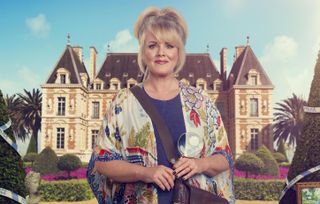 Jean White (Sally Lindsay) stands in front of a majestic chateau, holding a magnifying glass with police tape reflected in it