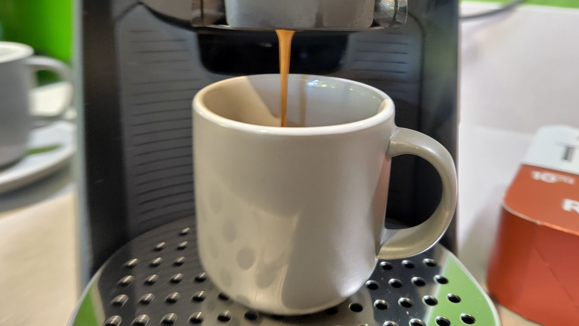 Lavazza Tabli coffee maker dispensing espresso