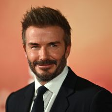 David Beckham poses on the red carpet upon arrival to attend the world premiere of the documentary '99', in Manchester, northern England on May 9, 2024
