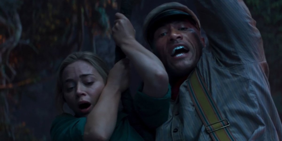 Emily Blunt and Dwayne Johnson in Jungle Cruise swinging around