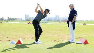 Tommy Fleetwood with his coach Alan Thompson at the 2018 Abu Dhabi Championship