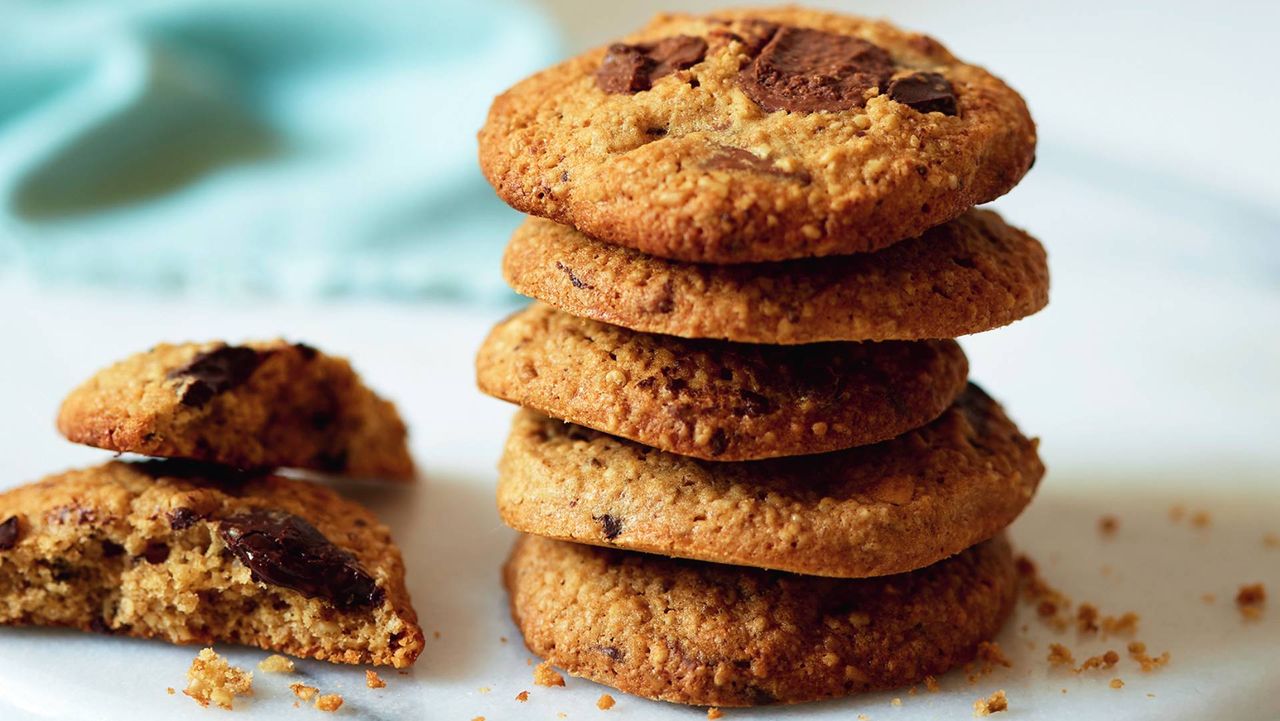 Stack of Chocolate chip gluten-free cookies on a marble board.