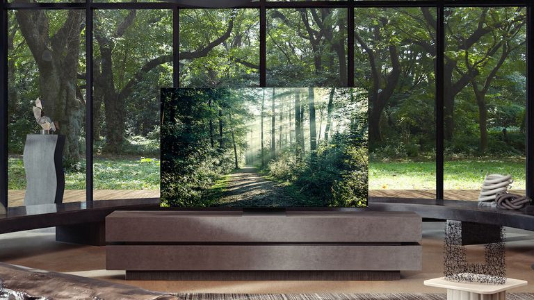 The best 8K TV sat in front of window in modern living room with trees in the background