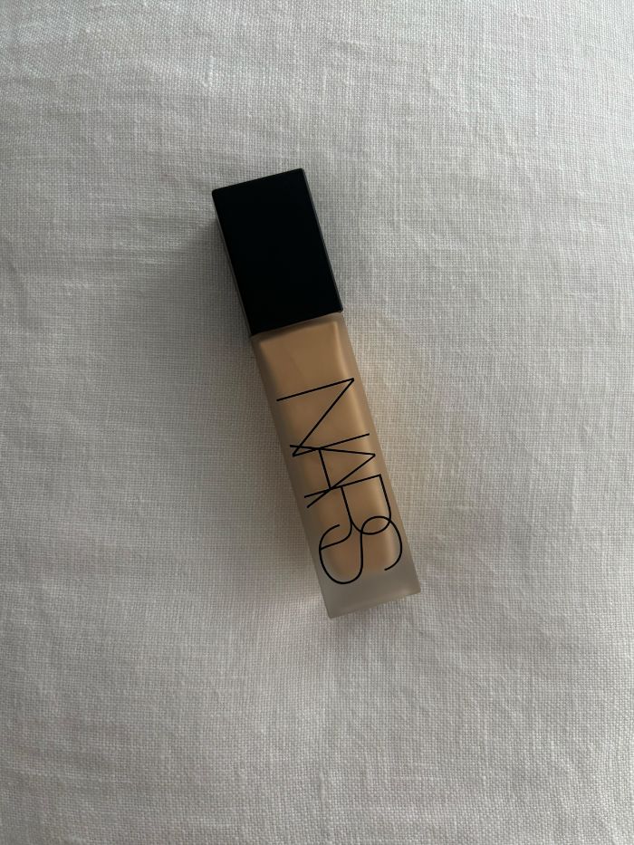 The Nars Natural Matte Longwear Foundation on a white linen background