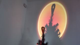 The XGIMI MoGo 4 Laser projector set-up with various accessories.