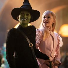 cynthia erivo as elphaba and ariana grande as galinda walking through the emerald city in wicked