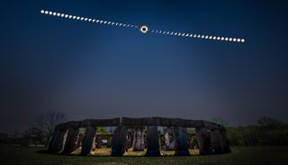 sequence of eclipse images appear high in the sky above Stonehenge II, a large stone structure.