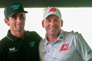 Joaquin Niemann and Sergio Garcia smile on the 18th green