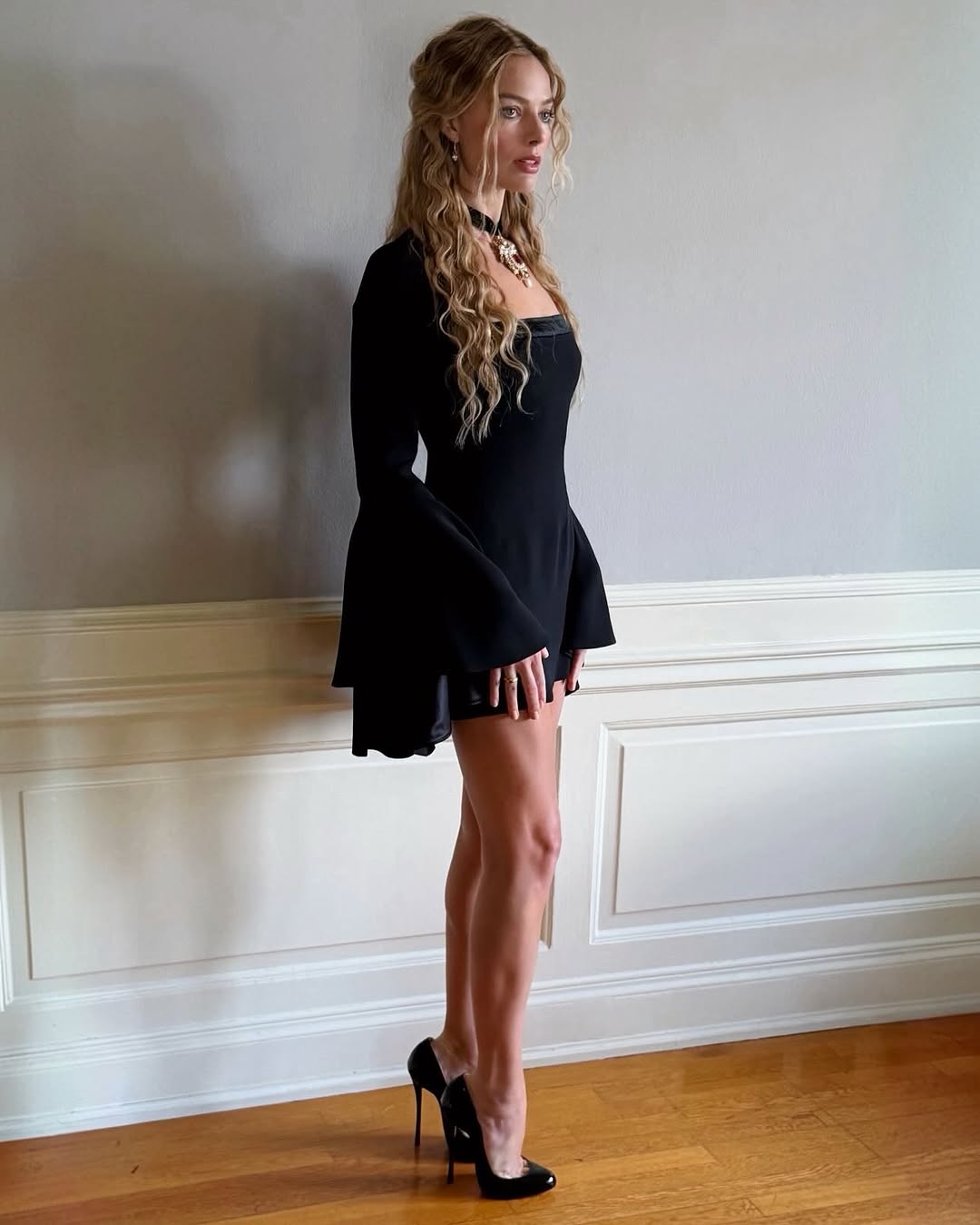 Margot Robbie began her Wuthering Heights press tour in a Victorian-inspired Robert Cavalli little black dress